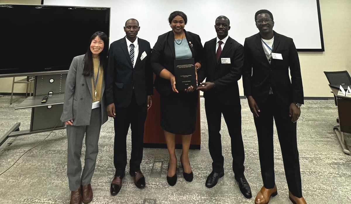 Ms. Edna Dioniz Chuku, Counselor for Economic Affairs, in a photo with Tanzania participants during the final presentation of the KIZUNA Program, including two PhD candidates and one master's degree graduate, accompanied by JICA representative, at JICA HQ